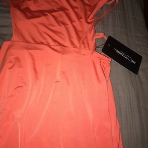 shape orange slinky lace up back bodycon dress